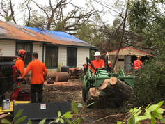 disaster response teams cleaning up after hurricane michael